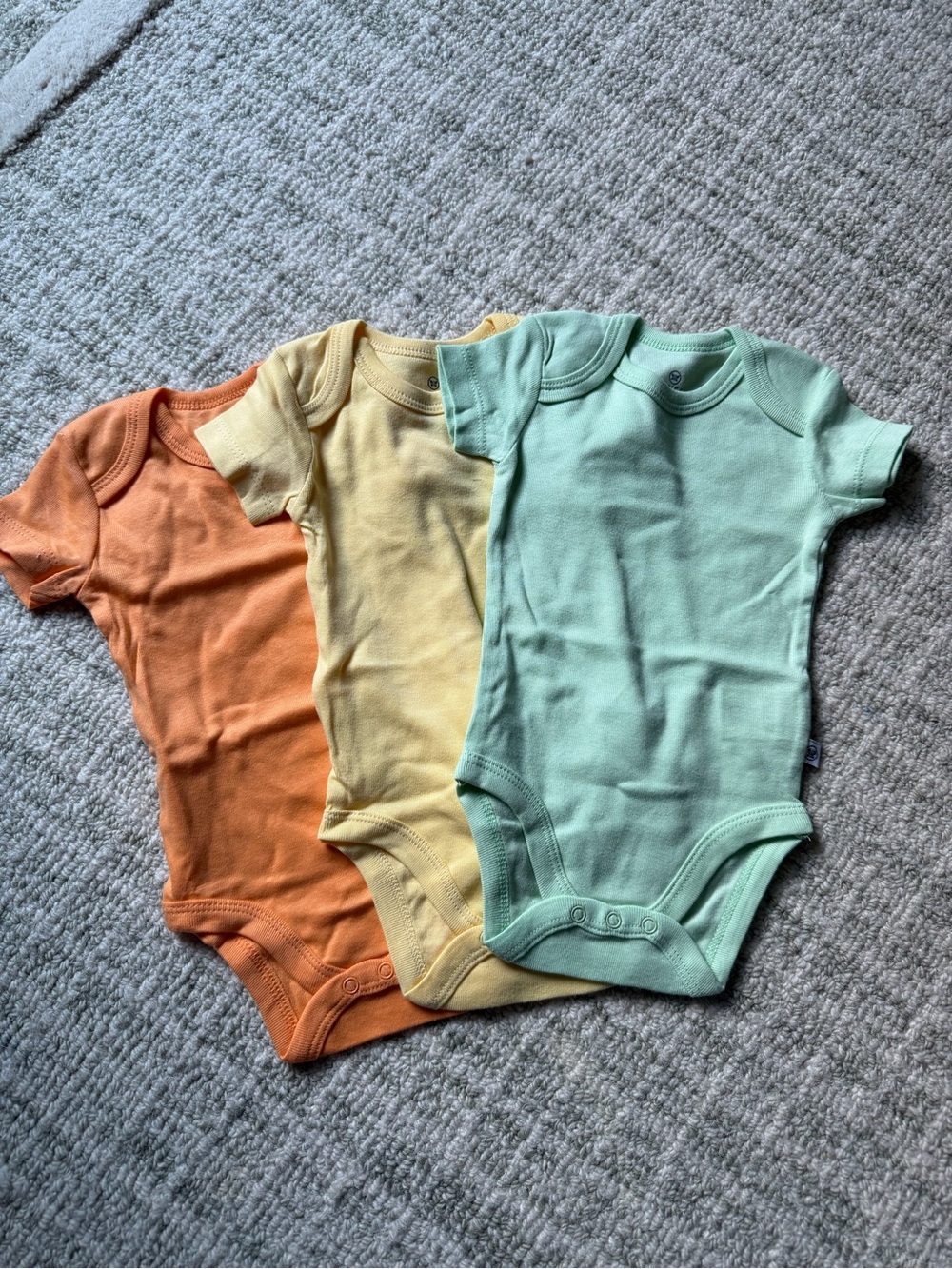 Four Short-Sleeve Bodysuits in Orange, Yellow, Light Blue and Mint Green